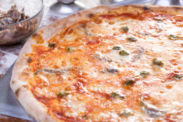close up of delicious pizzawith anchovies and capers