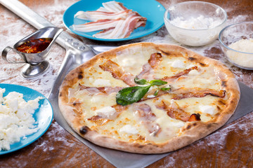 close up of delicious white intalian pizza with ham