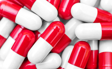 Red-white capsules as medical background.