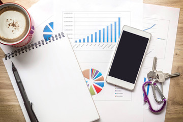 Top view with copy space ,office desk workplace with coffee cup on wooden background.