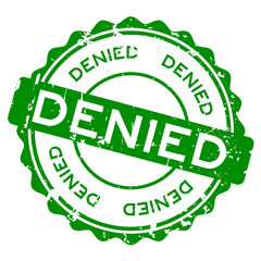Grunge green denied wording round rubber seal stamp on white background