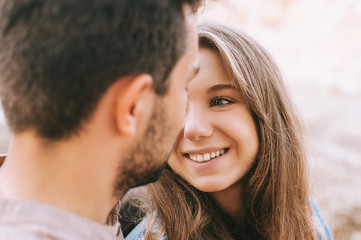 beautiful smiling girl looking at her boyfriend, selective focus