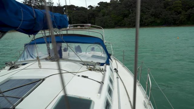onboard beneteau oceanis yacht steady gimbal shot stormy dark skies on kawau island new zealand