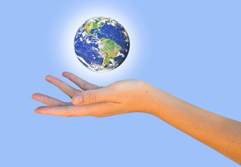 Planet earth on palm.Elements of this image furnished by NASA