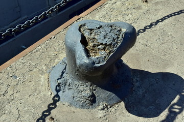 Destroyed metal bollard on the quay of the embankment of the Yenisei River in the city of Krasnoyarsk