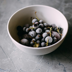 Frozen berries in a white plate on a table