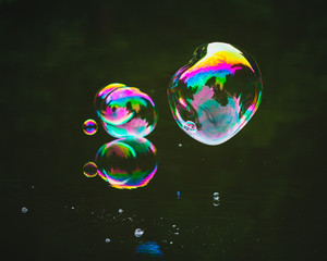 soap bubbles on lake water surface