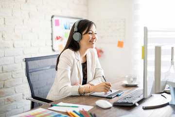 Smiling female designer at work