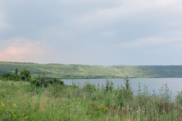 landscape meandering channel rocks canyons green vegetation