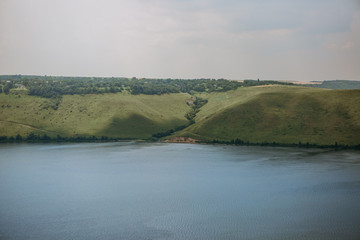 landscape meandering channel rocks canyons green vegetation