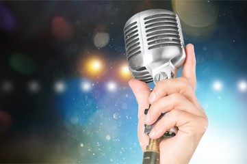 Retro style microphone on background