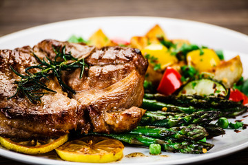 Grilled steak with french fries and vegetables 