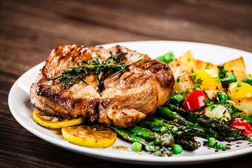 Grilled steak with french fries and vegetables 