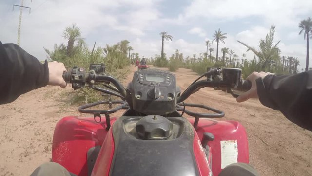 POV of riding a quad in Morocco tourist attraction