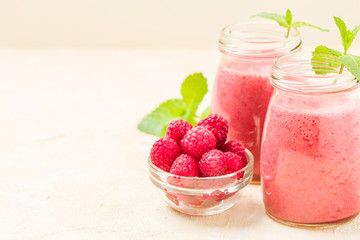 Raspberry smoothie close up photography with fresh summer blended cocktail and ripe berries on...