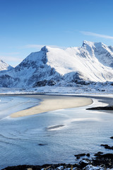 A view of Ytresand bay, Sandbotnen looking towards Fredvang village on the Lofoten islands, Norway