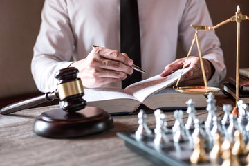 Legal law, advice and justice concept, Professional male lawyers working on courtroom sitting at...