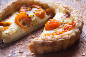 Tomato & camembert tart. Puff pastry filled with camembert cheese, tomatoes and basil