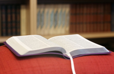 Abstract photo. Blurred photo. Book against the background of other books