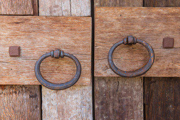 Wooden doors with old doorknob metal
