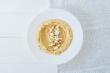 Colorful hummus bowls. Traditional hummus. Horizontal top view. Vegetarian dish.