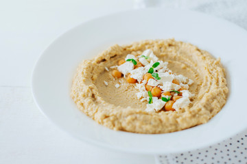 Colorful hummus bowls. Traditional hummus. Horizontal top view. Vegetarian dish.