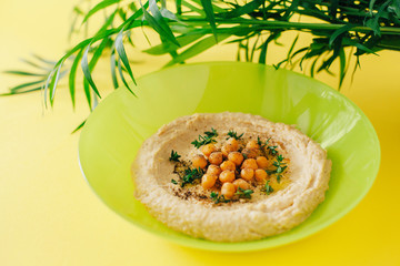 Colorful hummus bowls. Traditional hummus. Horizontal top view. Vegetarian dish.