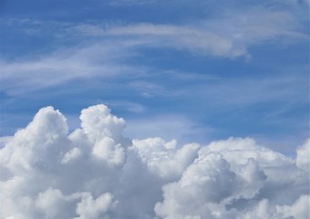Amazing cumulus clouds and sunlight on the background of clear blue sky, Summer in GA USA.