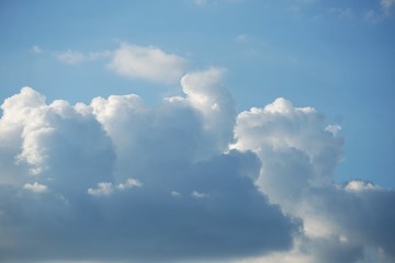 Amazing cumulus clouds and sunlight on the background of clear blue sky, Summer in GA USA.