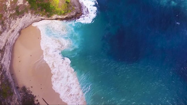 slow rise drone shot above kelingking beach nus penida bali indonesia