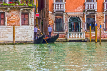 Fototapeta na wymiar Gondoliers in Venice Grand canal, Italy