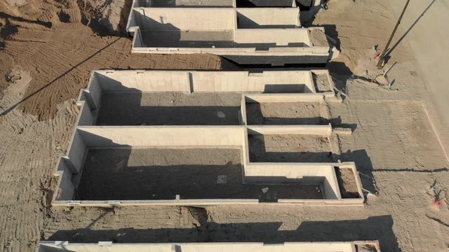 View of Housing fundation being constructed during sunrise