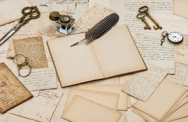 Open book old letter antique feather pen Used paper background