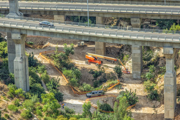 Continuation of construction work under the bridges.