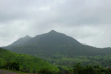 Foto op Canvas Lush green monsoon nature landscape mountains, hills, Purandar, Maharashtra, India © Sandeep