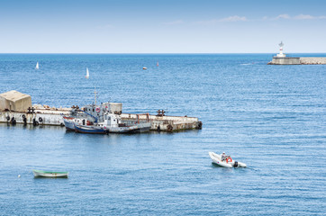 Russia, the peninsula of Crimea, the city of Sevastopol. 06/10/2018: The pier and the lighthouse at...
