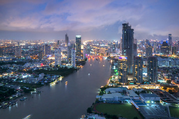 Fototapeta na wymiar Aerial view of Bangkok modern office buildings, condominium, living place in Bangkok city downtown with sunset scenery, Bangkok is the most populated city in Southeast Asia.Bangkok , Thailand