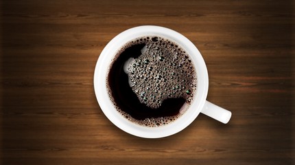Black coffee on wooden desk