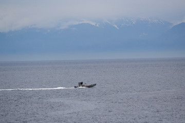 Fototapeta premium Boat with mountains far away