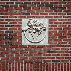 Concrete Flower on Red Brick Wall