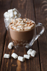 Glass cup of cocoa with marshmallow