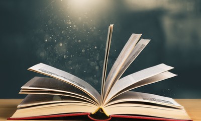 Open book on old wooden table