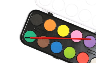 Watercolor pallet and paintbrush for painting isolated on white