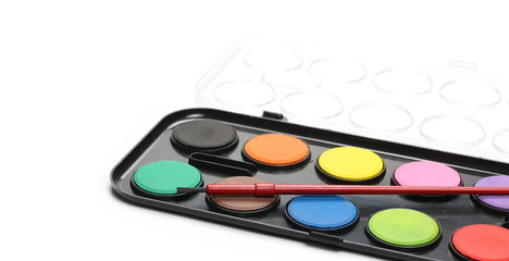Watercolor pallet and paintbrush for painting isolated on white