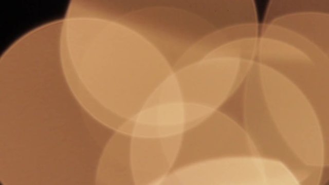 Blur balls of gold on black background HD