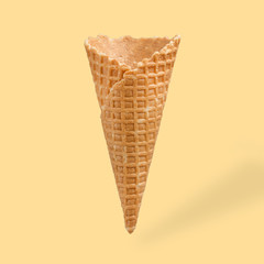 empty ice cream cone, on an orange background