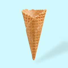 Waffle cornet on light blue background