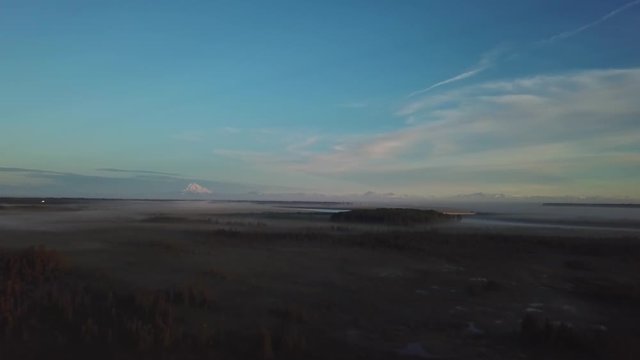 Beautiful foggy sunrise over the Kenai River flats at 5am in Alaska.