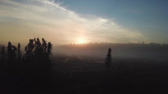 Beautiful foggy sunrise over the Kenai River flats at 5am in Alaska.