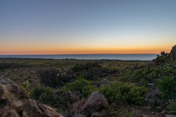 Sunset landscape in the vicinity of the Llanos del Challe park. Desert of Atacama, northern Chile